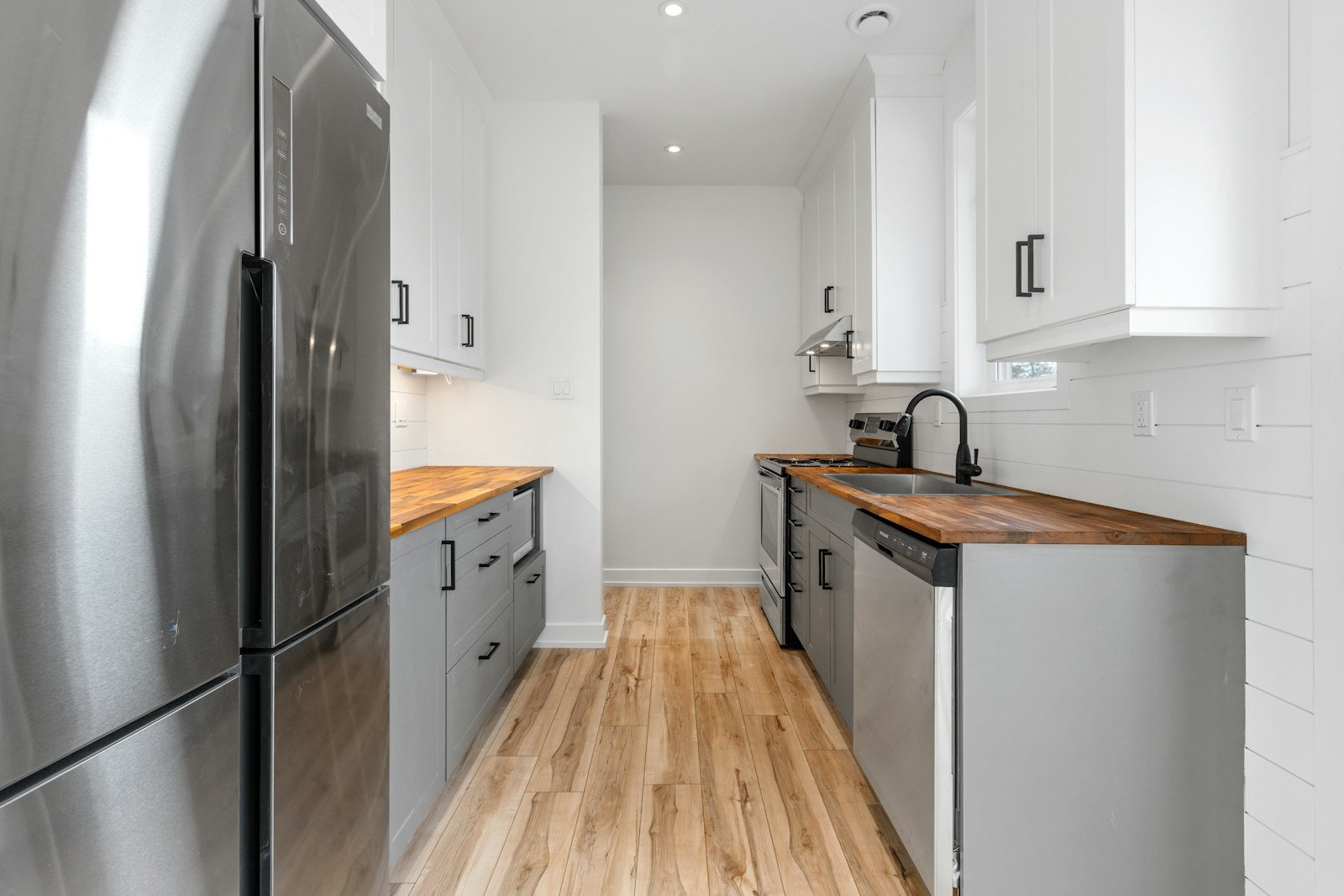 a kitchen with white cabinets